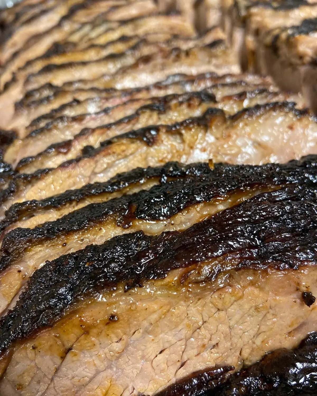 Closeup of Huck's bark-crusted, glazed smoked brisket